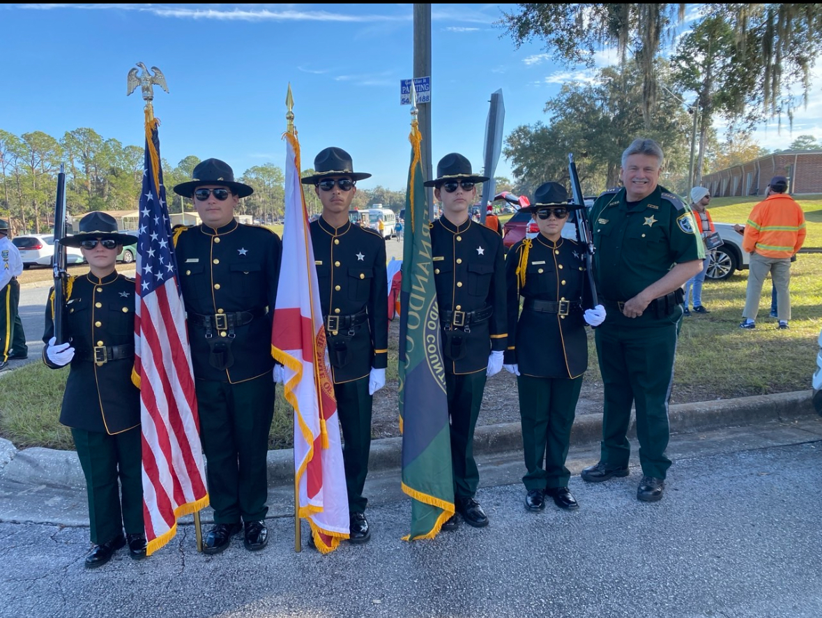 Explorer Post 409 honor guard presenting the colors at a community parade